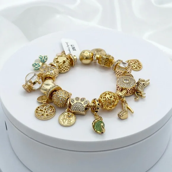 Linx Yellow Gold Bracelet with Gold and Green Themed Charms